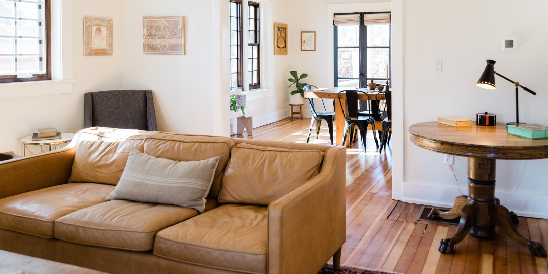 Cozy living room with hardwood floors, white walls, minimalist decor